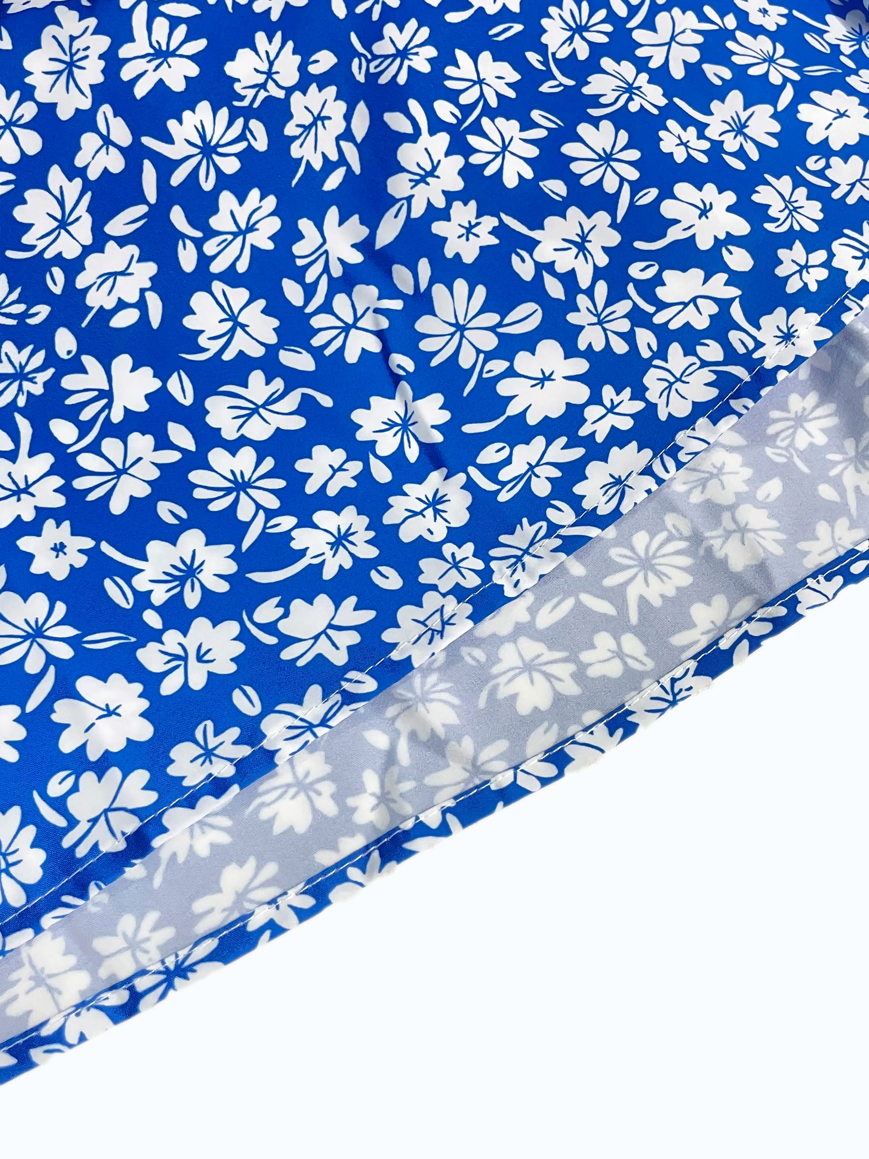 The cami dress with small flower prints a backless design
