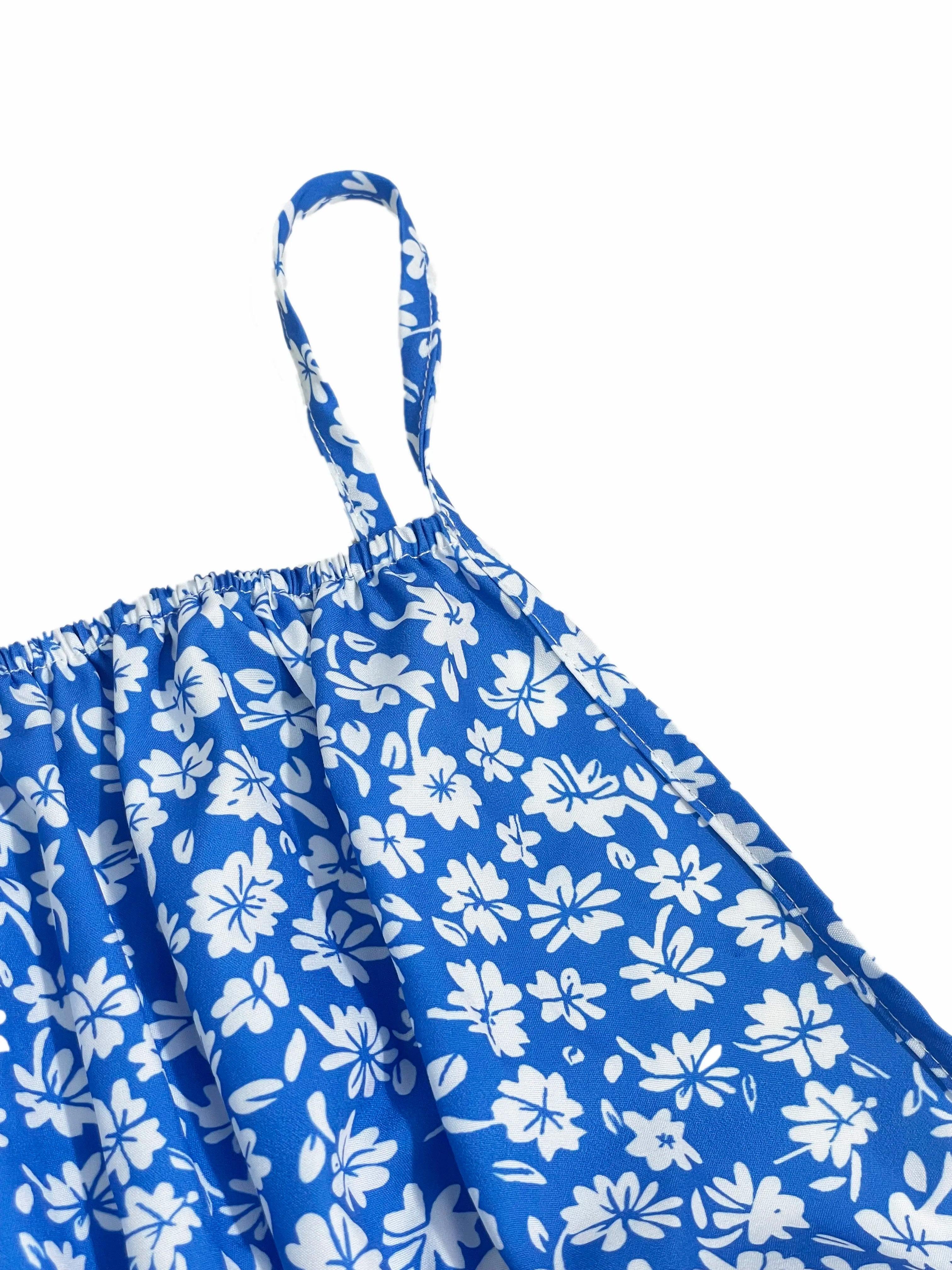 The cami dress with small flower prints a backless design